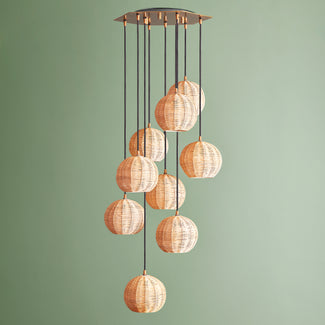 Solaris chandelier in brass and rattan