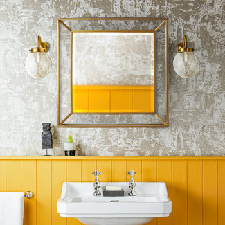 Grenada Mirror in an antiqued brass finish.