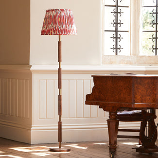 Skellig floor lamp in burnt wood and brass