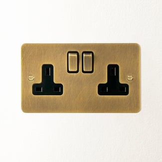 Lucian double socket with black inserts in aged brass