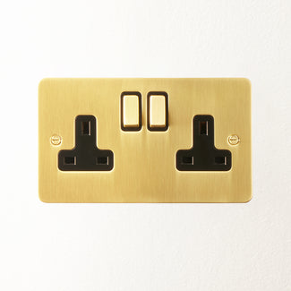 Lucian double socket with black inserts in top brass