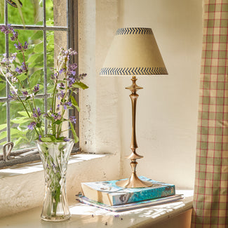 Spindle rechargeable table lamp in aged brass