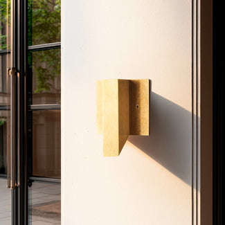 Andor IP54 fixed wall light in brass